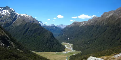Expansive valley view with snow-capped mountains on Routeburn Track