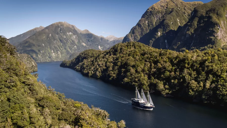 Aerial view of the Fiordland Navigator sailing through Doubtful Sound in Fiordland National Park
