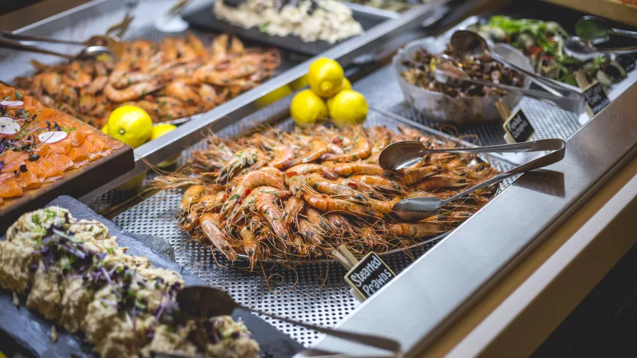 Buffet seafood display with prawns, smoked salmon, and shellfish