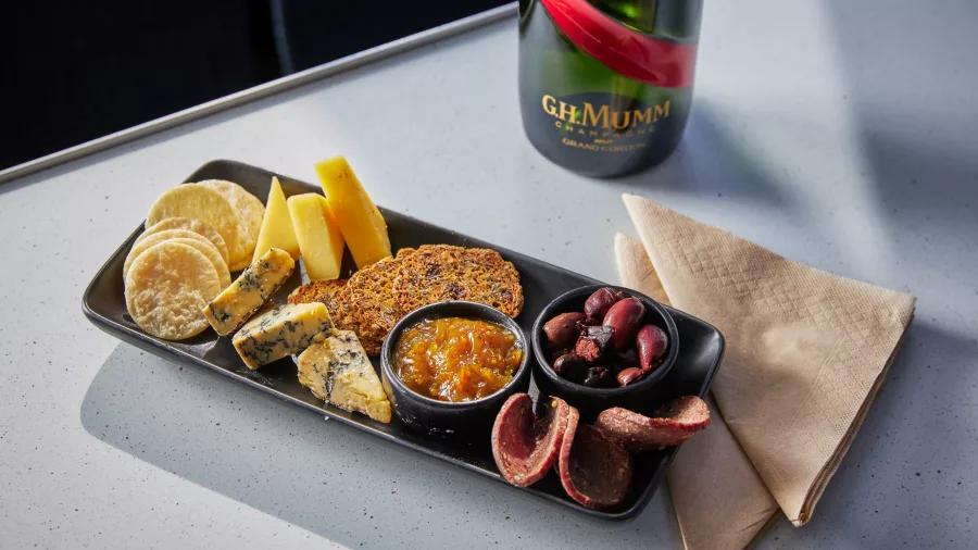 Platter of New Zealand cheeses and artisan snacks served on a Milford Sound luxury cruise