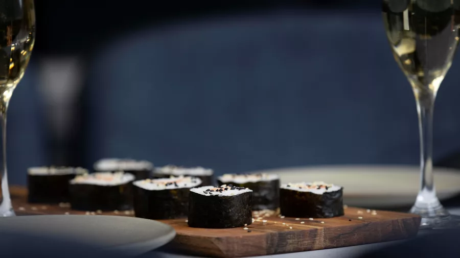 Sushi and champagne served on board a luxury Milford Sound Business Class Cruise