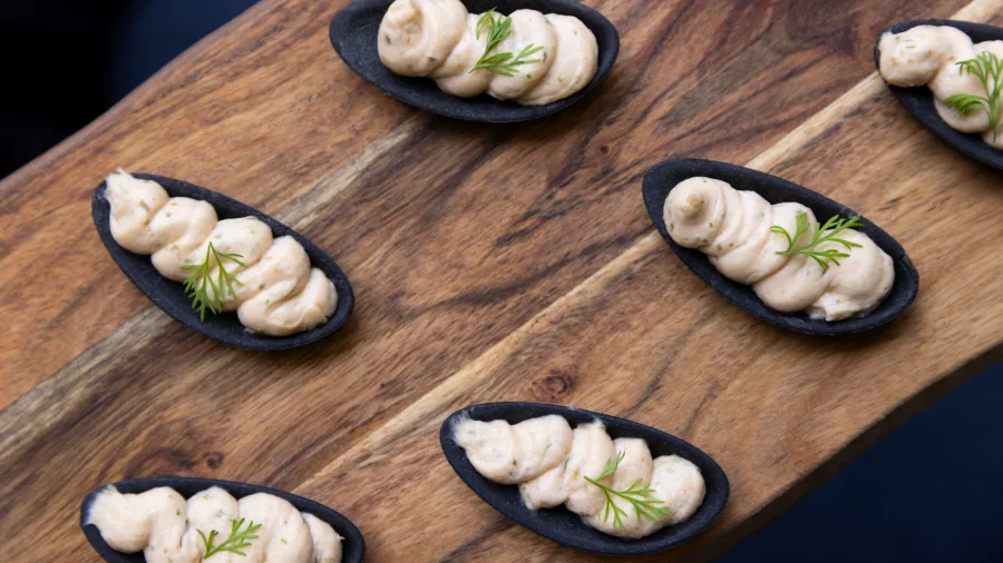 Beautifully plated canapés with fresh herbs served on board the MV Sinbad Milford Sound cruise
