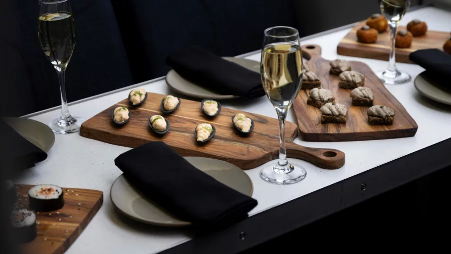 Selection of canapés and champagne served on a luxury cruise