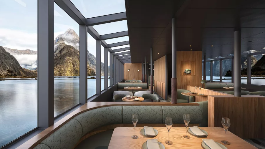 Interior of MV Sinbad with panoramic windows and table settings