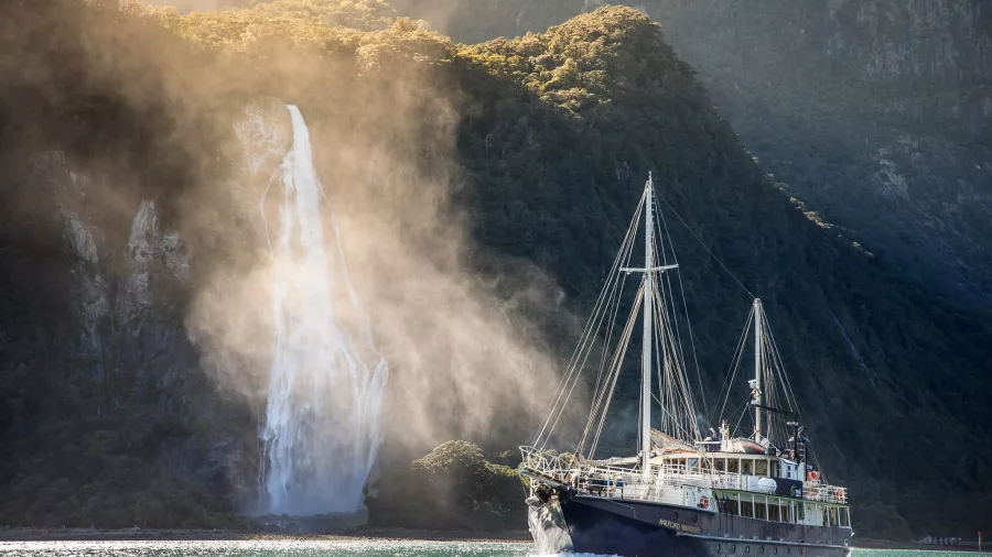 Milford Wanderer sailing past Stirling Falls in Milford Sound