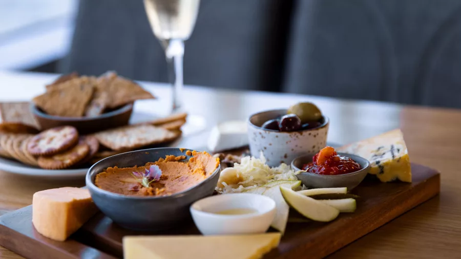 Snack platter with meats, cheeses, and olives on the Spirit of Queenstown Lake Cruise.