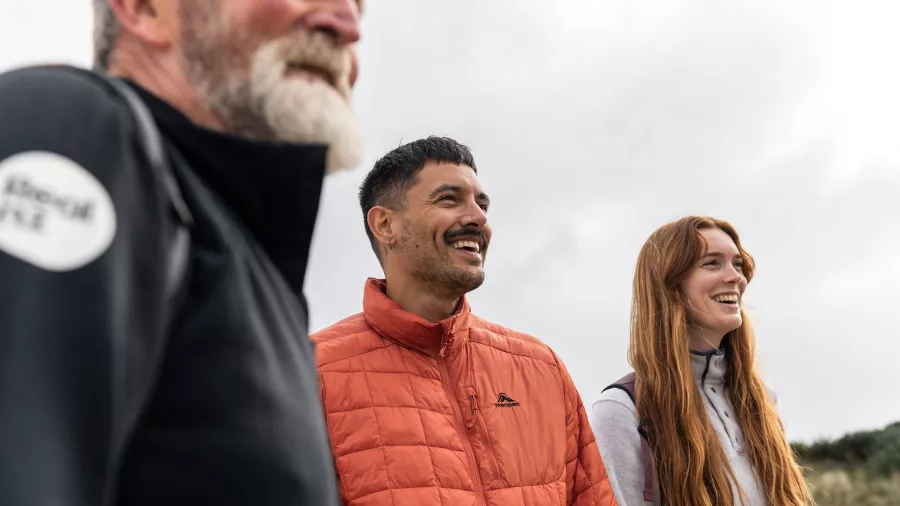 Happy group enjoying a guided tour at Oneke, Stewart Island