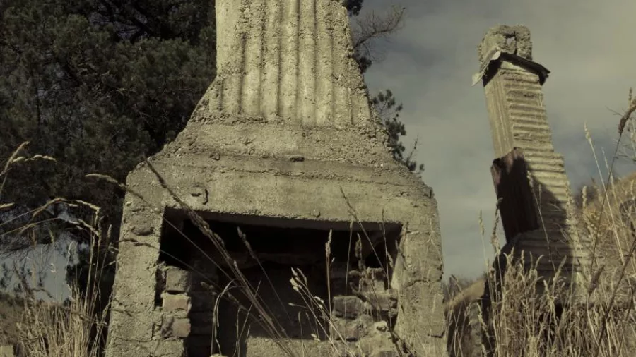 Crumbling stone chimney from an old gold rush-era home in Central Otago