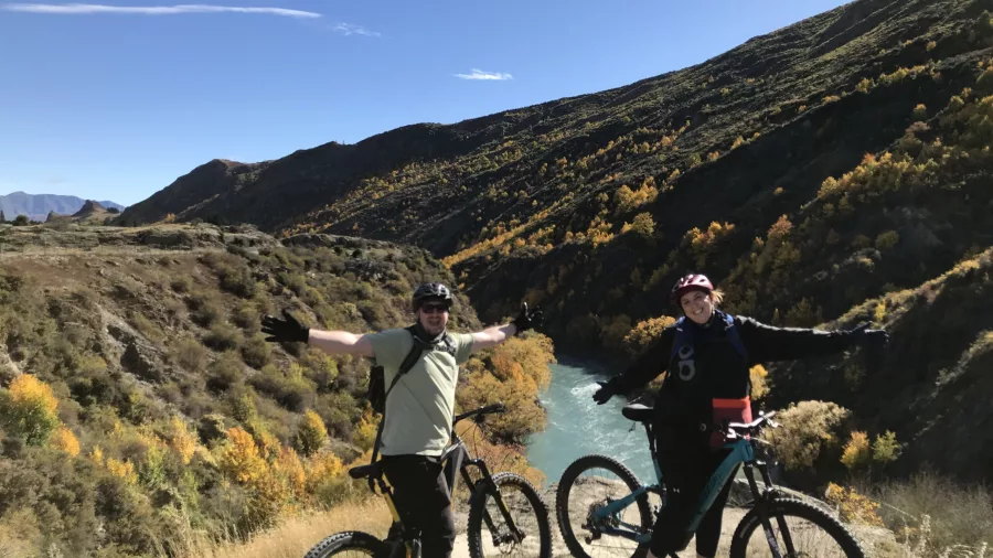 Cyclists posing at lookout above Kawarau River near Queenstown