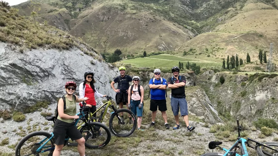 E-bike group stopping at a scenic viewpoint above Gibbston Valley