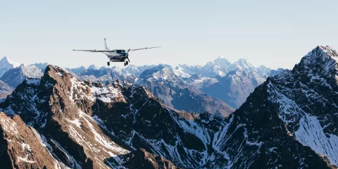 True South aircraft soaring over rugged snow-capped peaks of the Southern Alps on a Mount Cook scenic flight