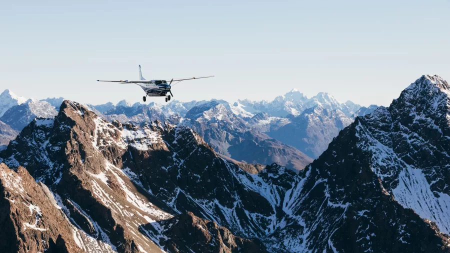 True South aircraft soaring over rugged snow-capped peaks of the Southern Alps on a Mount Cook scenic flight