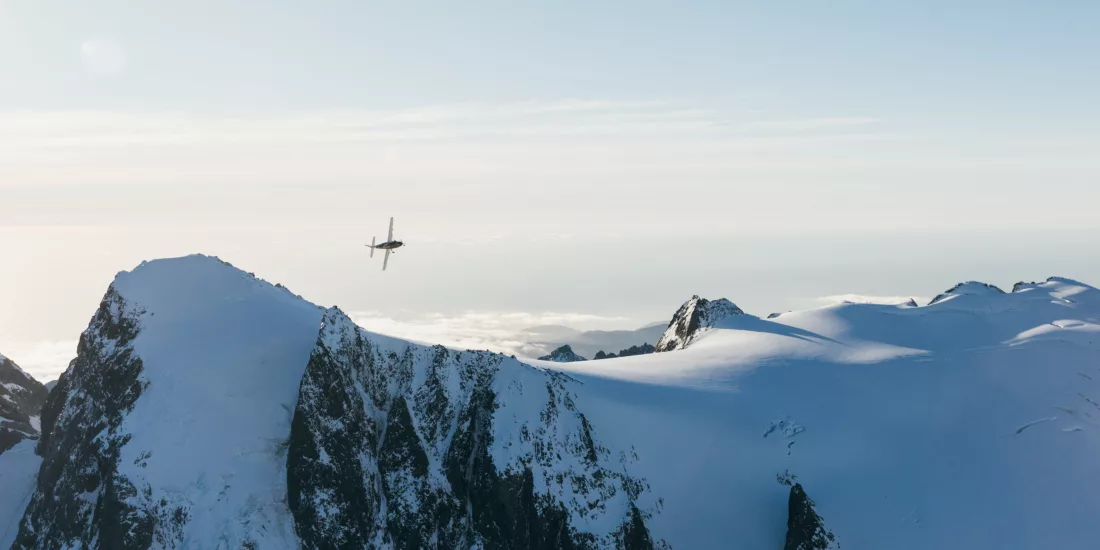 Scenic flight over snowy peaks in the Southern Alps with True South