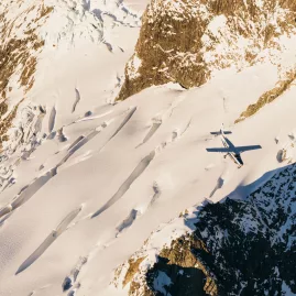 True South aircraft flying over glacier crevasses in the Southern Alps