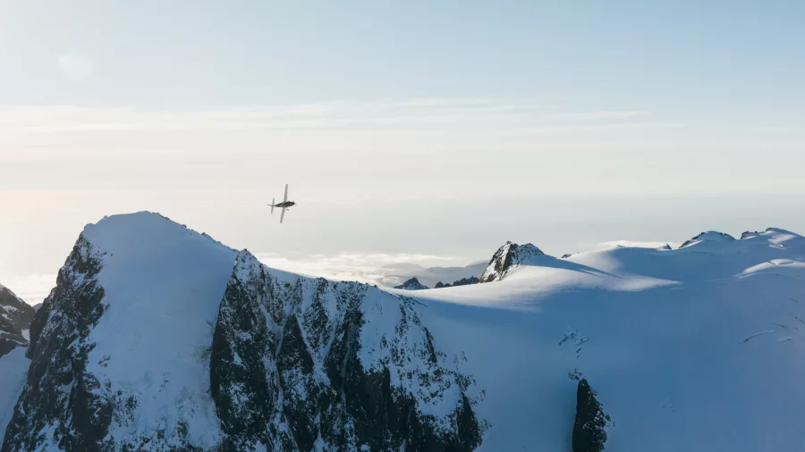 Scenic flight over snowy peaks in the Southern Alps with True South