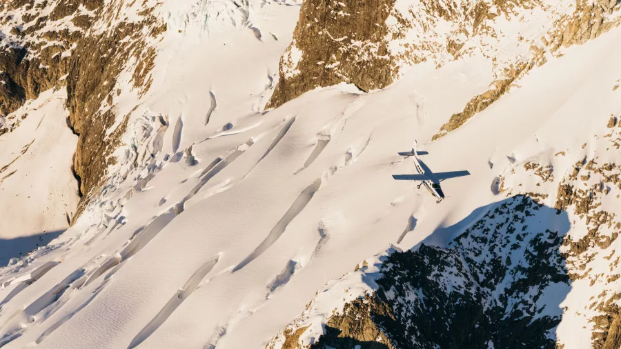 True South aircraft flying over glacier crevasses in the Southern Alps