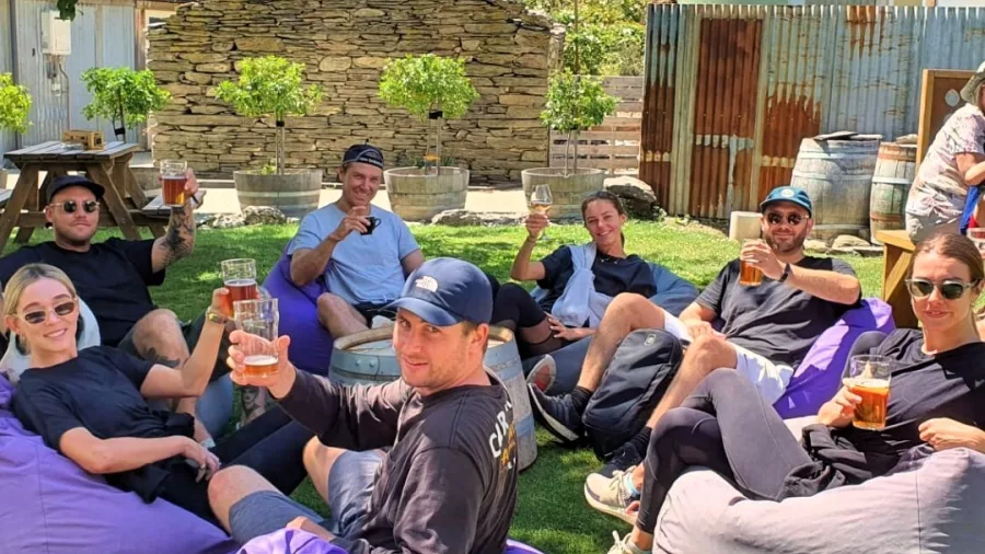 Group enjoying craft beers on beanbags at Gibbston Tavern in Queenstown’s Gibbston Valley