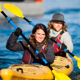 Two people paddling a double kayak during a Paddle Wanaka freedom rental.