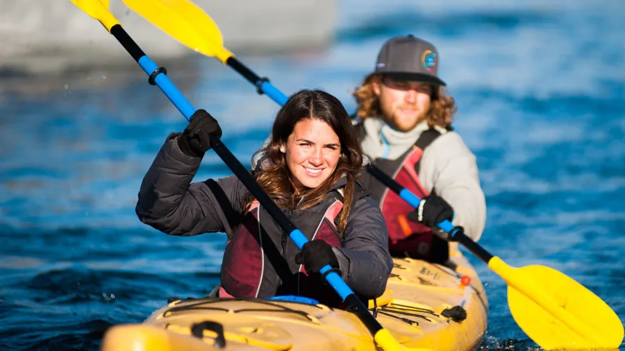 Two people paddling a double kayak during a Paddle Wanaka freedom rental.