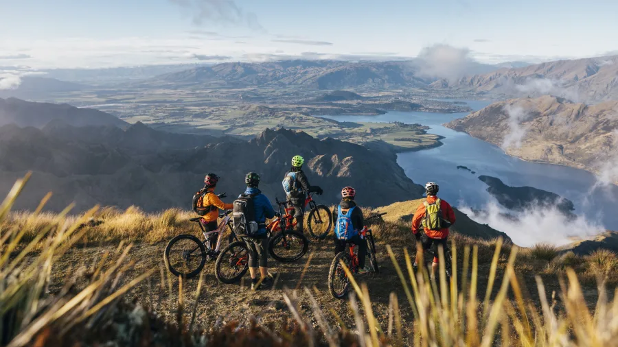 Group of cyclists taking in panoramic views above Lake Dunstan
