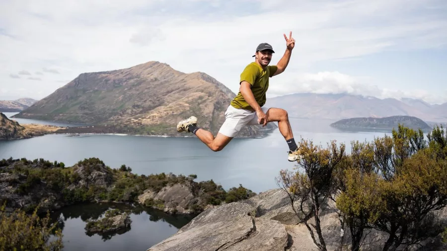 Person jumping joyfully on Mou Waho overlook