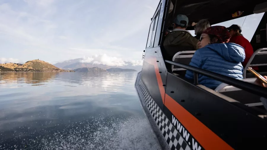 Passengers aboard Mou Waho Express water taxi