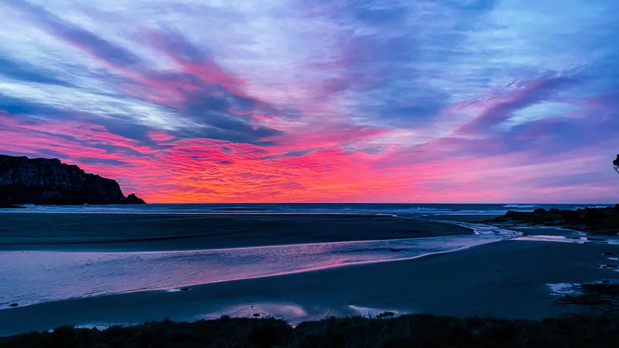 Dramatic sunset over Purakaunui Bay in The Catlins, Southland, New Zealand