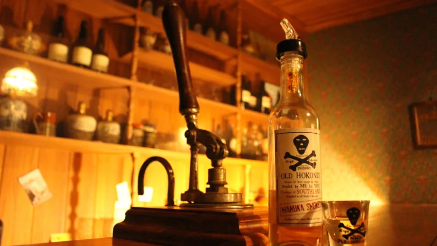 Bottle of Old Hokonui whisky on display at the Hokonui Moonshine Museum in Gore, Southland, New Zealand