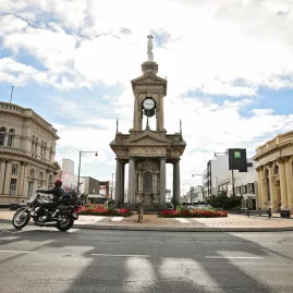 Motorcyclist passing the Troopers Memorial during the Burt Munro Challenge in Invercargill