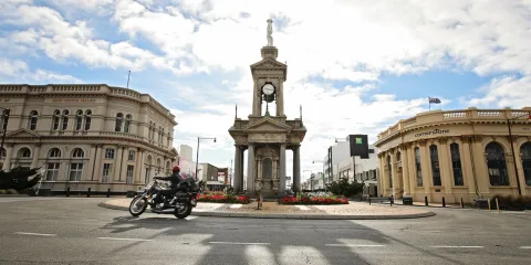 Motorcyclist passing the Troopers Memorial during the Burt Munro Challenge in Invercargill