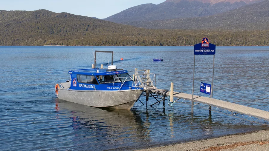 Water taxi at Te Anau lakefront ready to transport hikers to Kepler Track