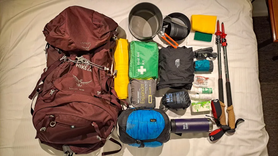Hiking gear and equipment laid out for Kepler Track tramp in Southland, New Zealand