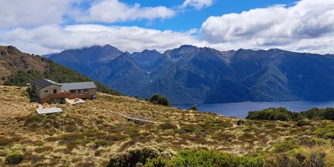 Luxmore Hut with views over Lake Te Anau on the Kepler Track, Southland, New Zealand