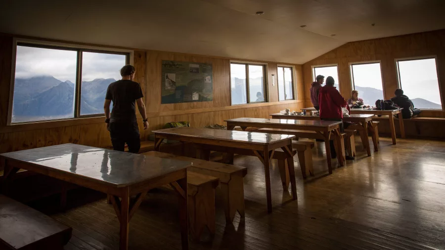 Dining area inside Luxmore Hut on the Kepler Track, Southland, New Zealand