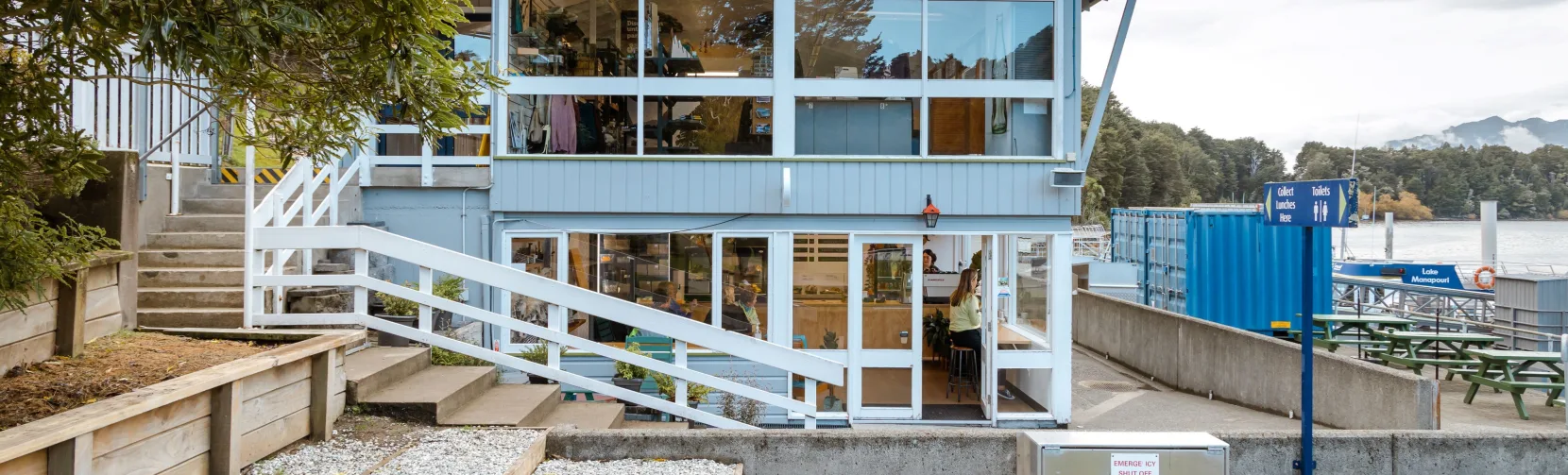 Manapouri Water Taxi office building near the lakefront, gateway to Fiordland adventures.