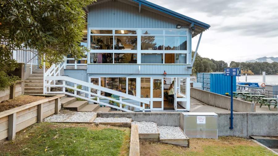 Manapouri Water Taxi office building near the lakefront, gateway to Fiordland adventures.