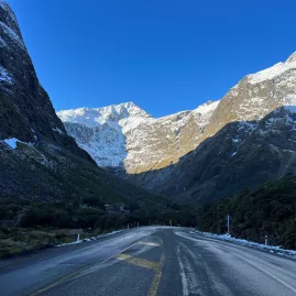 Snow-lined Milford Road approaching the Homer Tunnel in Southland, New Zealand