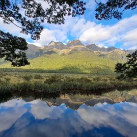 Mountain reflections at Mirror Lakes along Milford Road in Fiordland, New Zealand