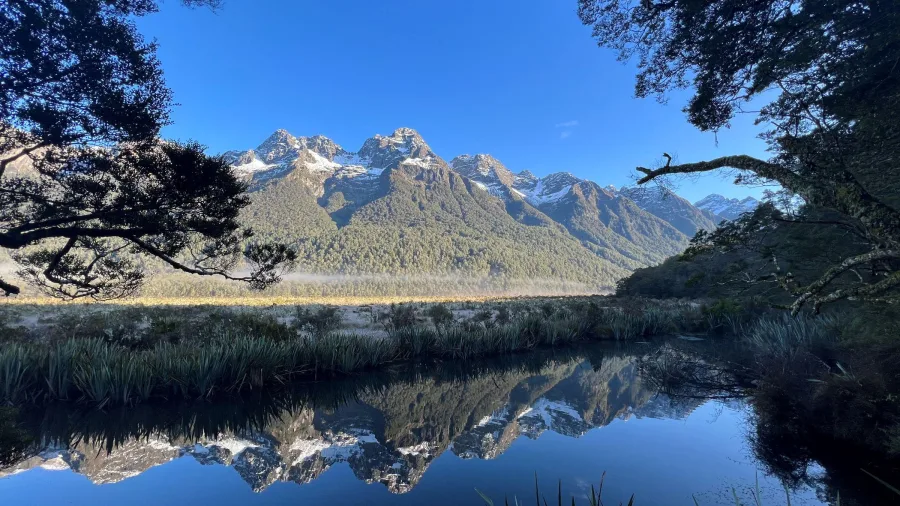 Clear morning reflections at Mirror Lakes on the Milford Road in Southland, New Zealand