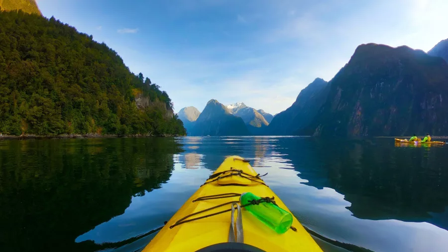 Kayaking towards Mitre Peak in Milford Sound Piopiotahi, Fiordland National Park, New Zealand