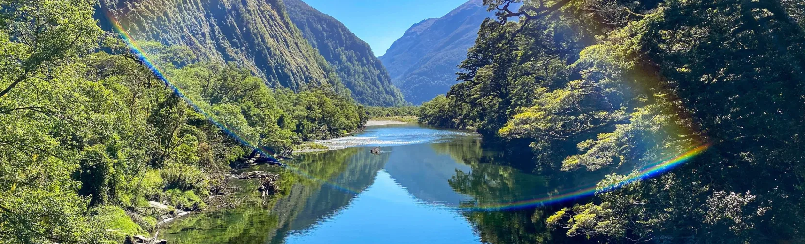 Rainbow over the Arthur River on the Milford Track in Fiordland National Park, New Zealand