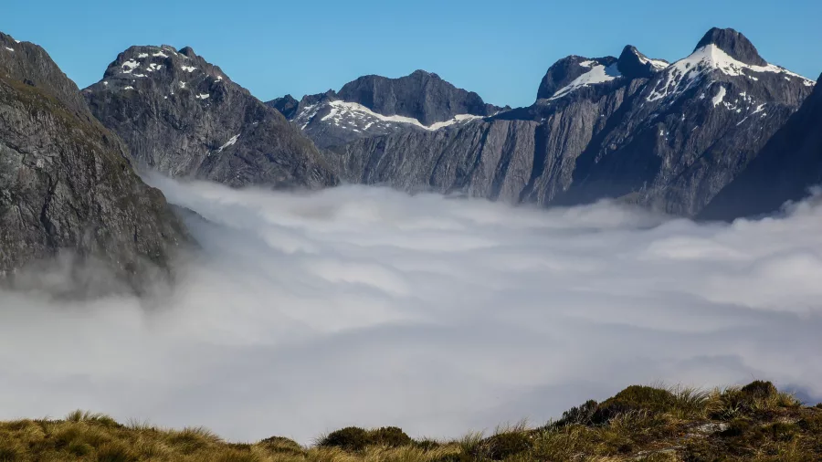 Sea of clouds over mountain peaks on the Milford Track, Fiordland New Zealand