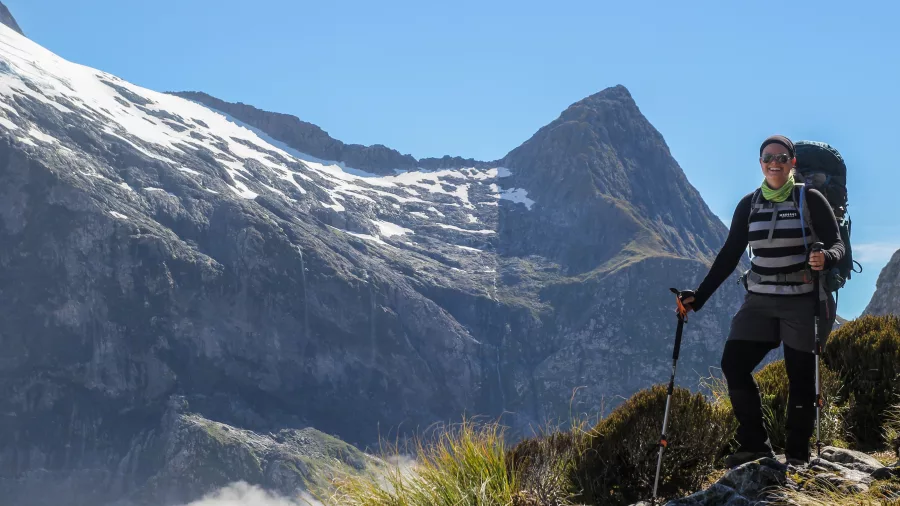 Hiker enjoying mountain views on the Milford Track, Southland New Zealand