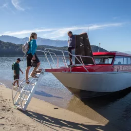 Walkers boarding the water taxi at Brod Bay to begin the Kepler Track day walk.