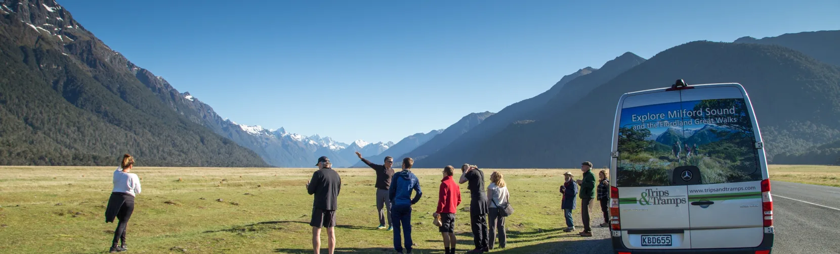 Guided group stop in Eglinton Valley with panoramic mountain views.