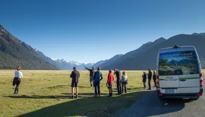 Guided group stop in Eglinton Valley with panoramic mountain views.