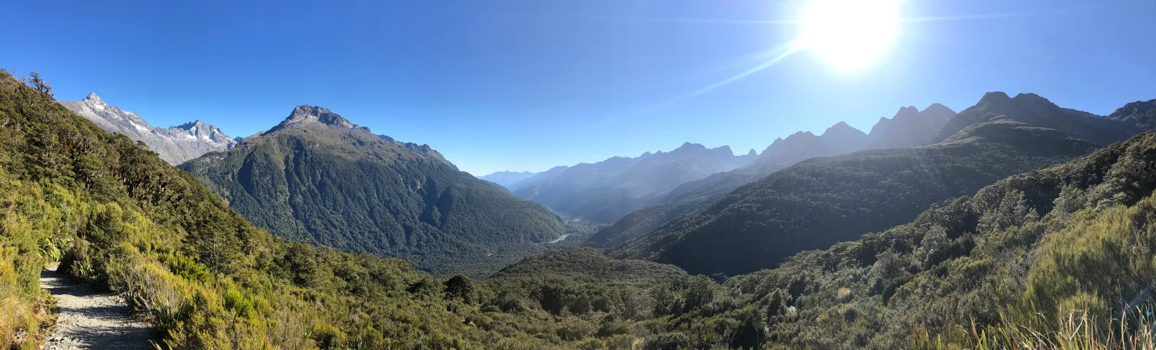 Scenic alpine view along the Routeburn Track near Earland Falls with mountains, valleys and native forest in Fiordland National Park, Southland New Zealand