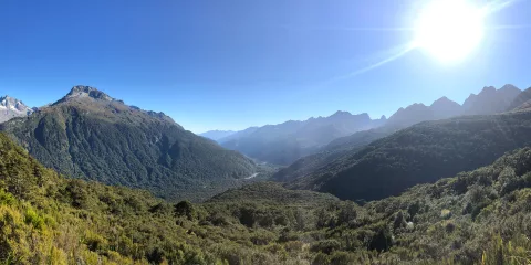 Scenic alpine view along the Routeburn Track near Earland Falls with mountains, valleys and native forest in Fiordland National Park, Southland New Zealand