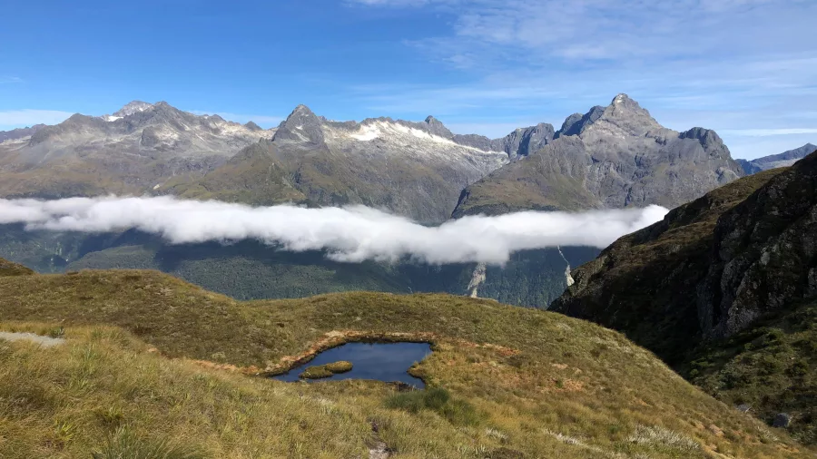 Tarn with surrounding mountains on the Routeburn Track, Fiordland, New Zealand