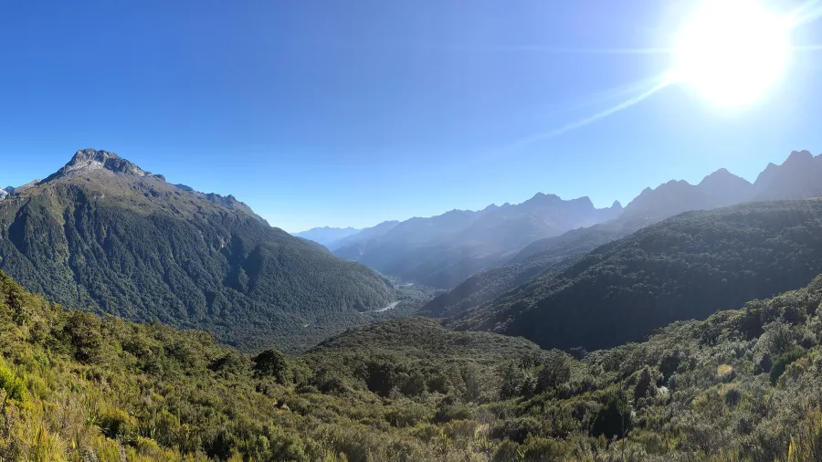 Scenic alpine view along the Routeburn Track near Earland Falls with mountains, valleys and native forest in Fiordland National Park, Southland New Zealand